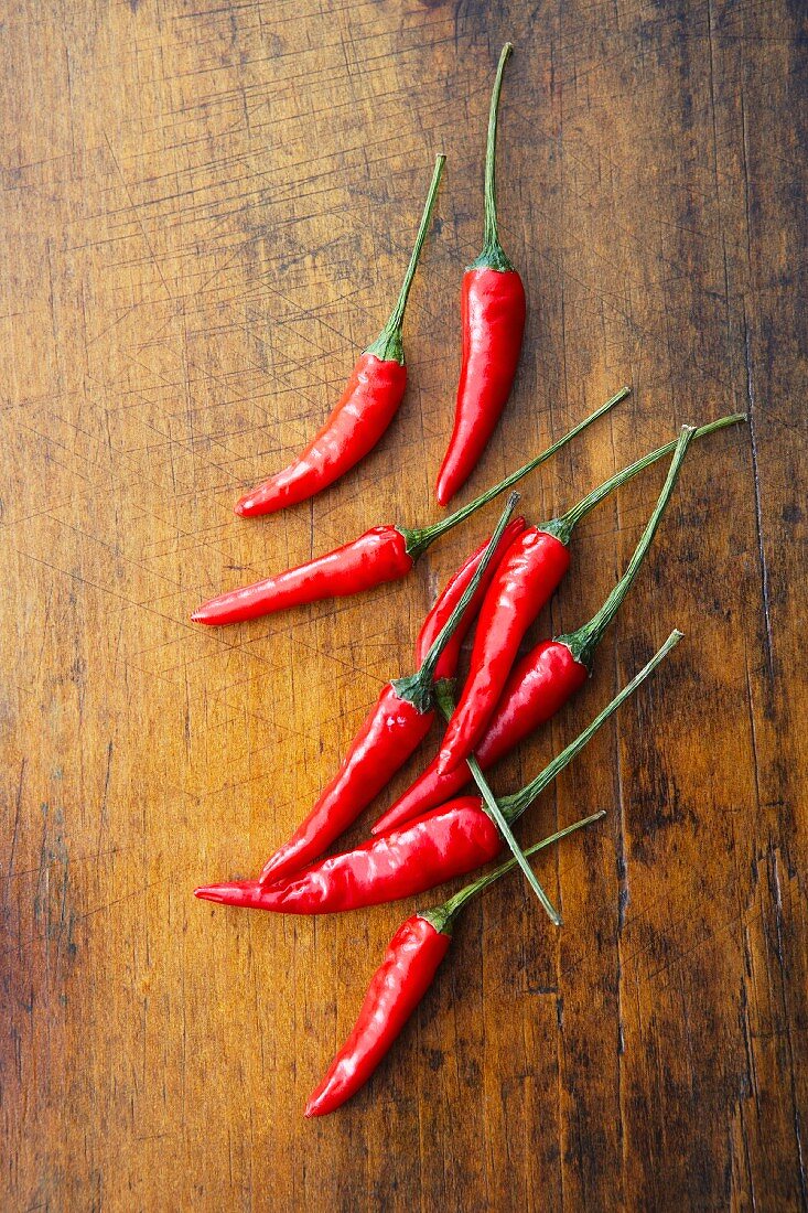 Thai peppers on a wooden surface