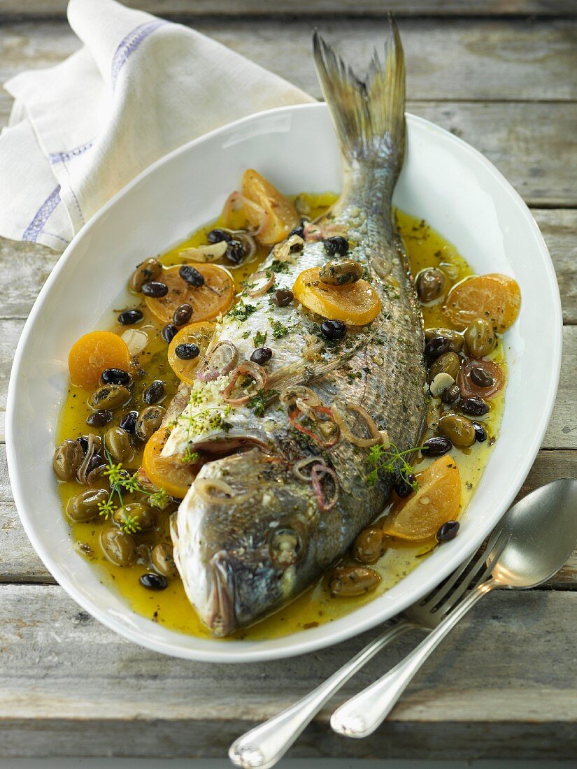 Gilthead seabream with olives and lemon confit