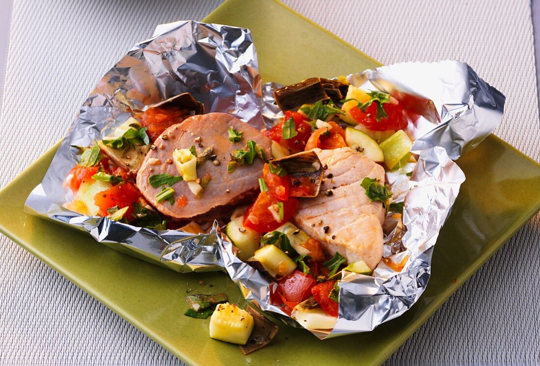 A duo of fine fish with Mediterranean vegetables in aluminium foil