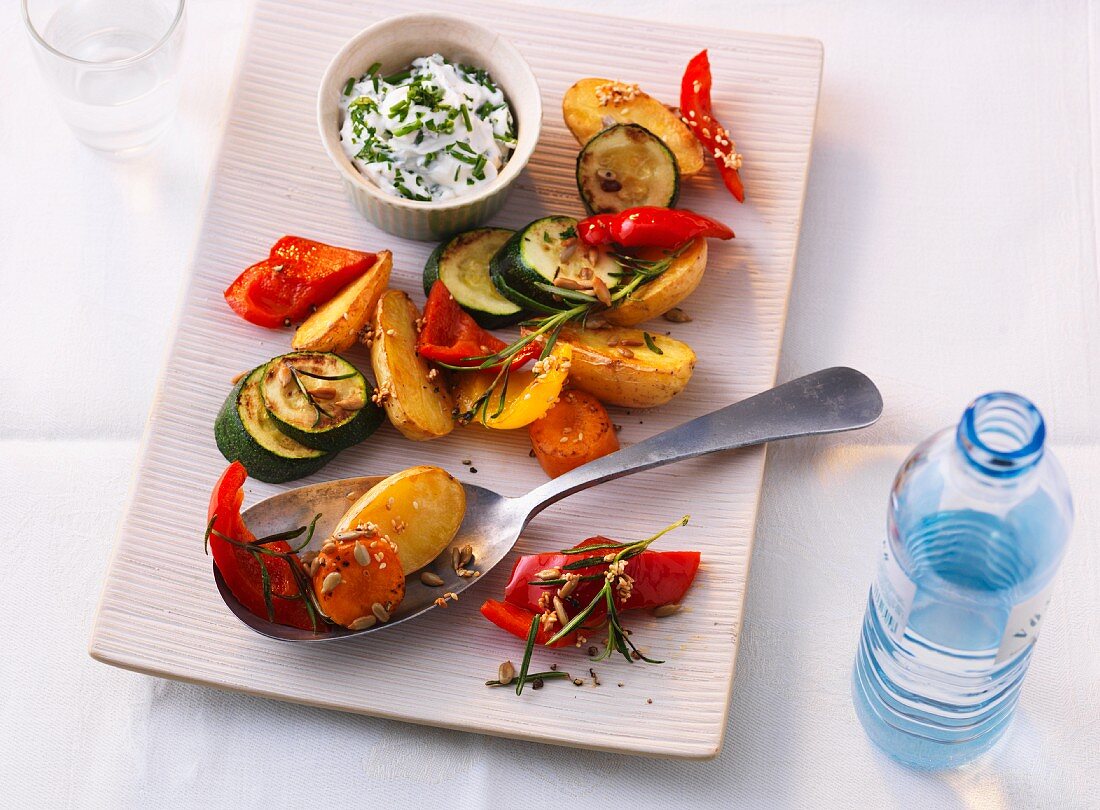 Oven-roasted vegetables with a herb and quark dip