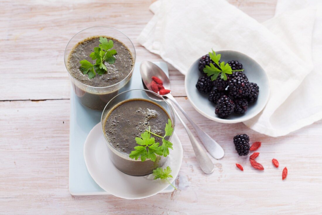 A blackberry smoothie made with goji berries, bananas, chard, parsley and cos lettuce