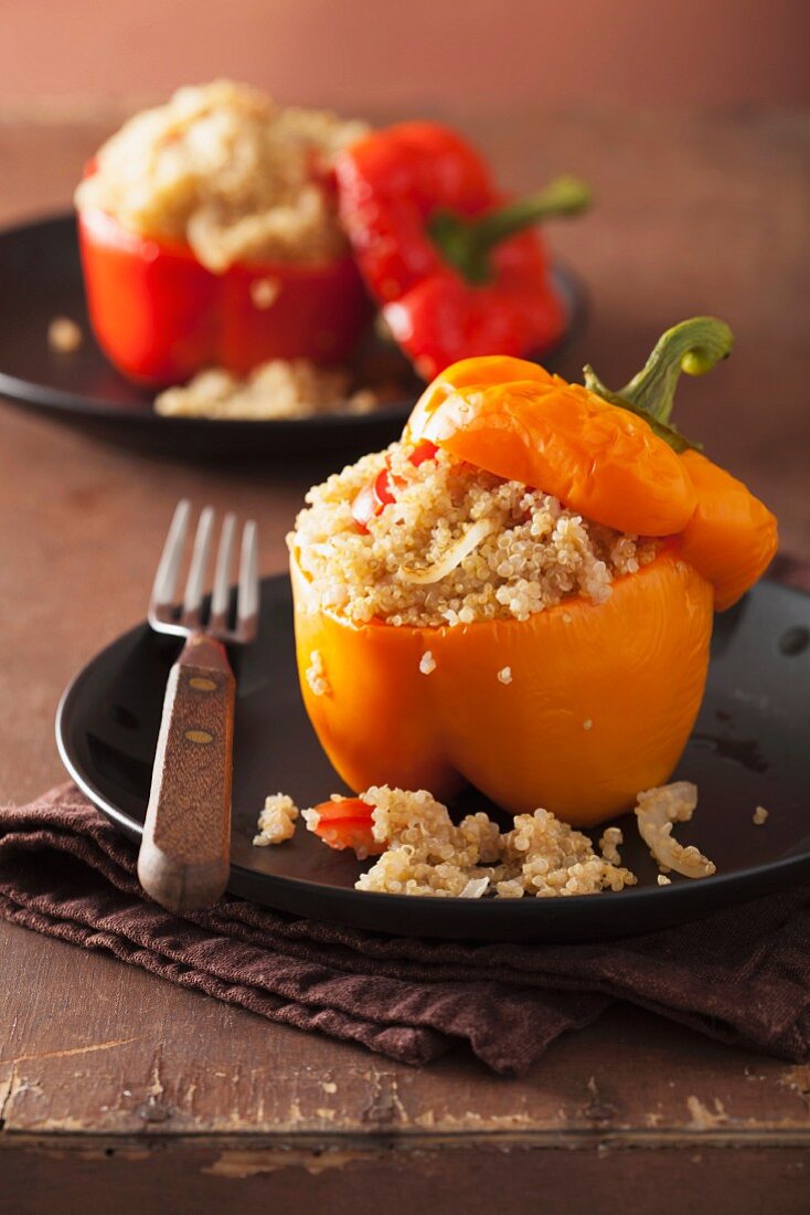 Red and yellow peppers filled with quinoa