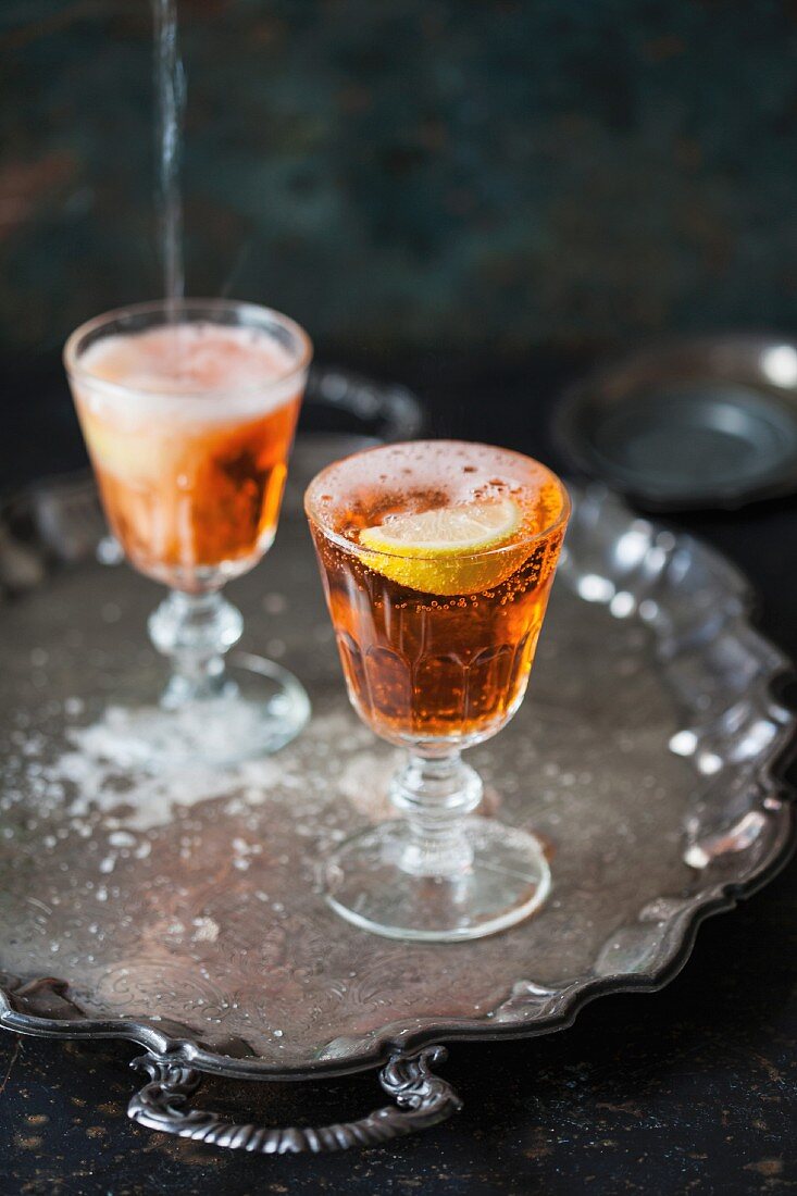 Two glasses of Aperol Spritz on a tray