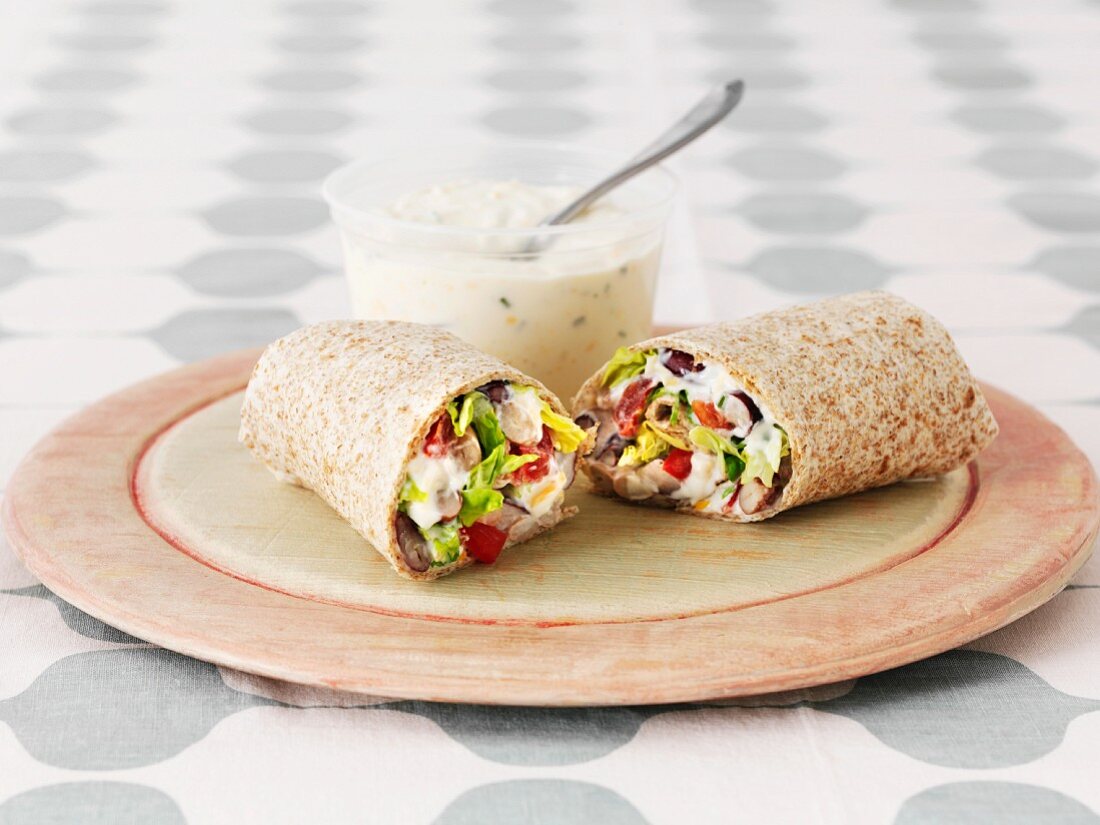 Three bean wraps with sour cream and a chive dip