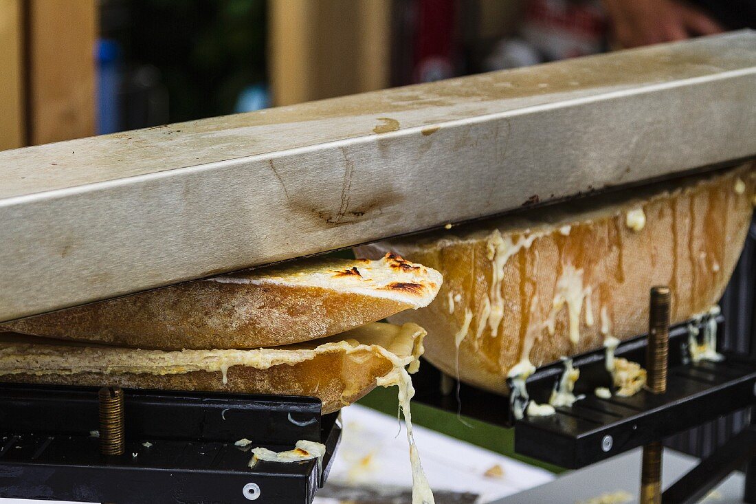 Raclette cheese being warmed