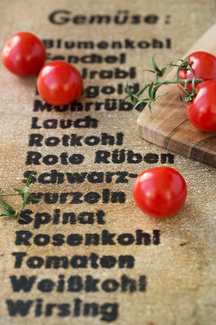 Cherry tomatoes on a board