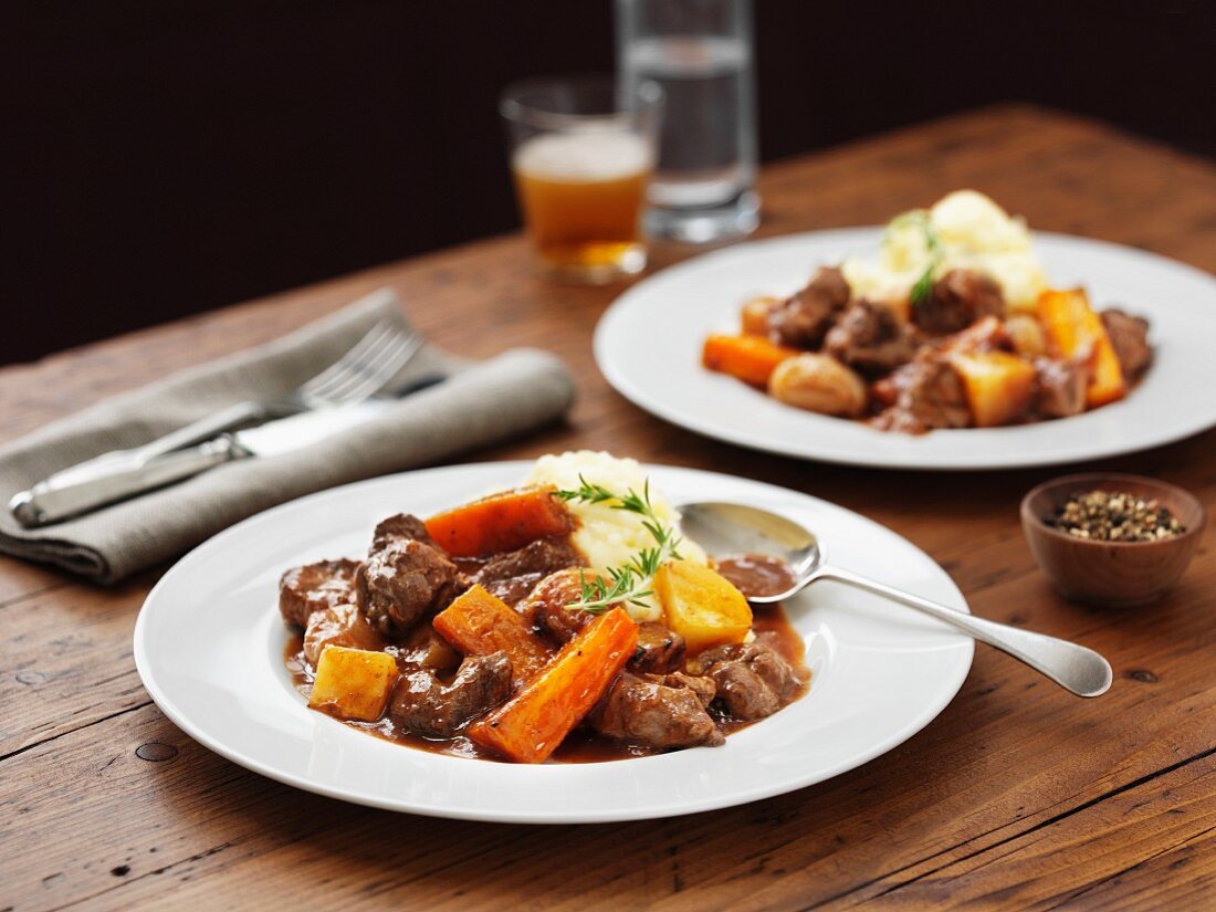 Lamb stew with mashed potatoes, carrots and beer