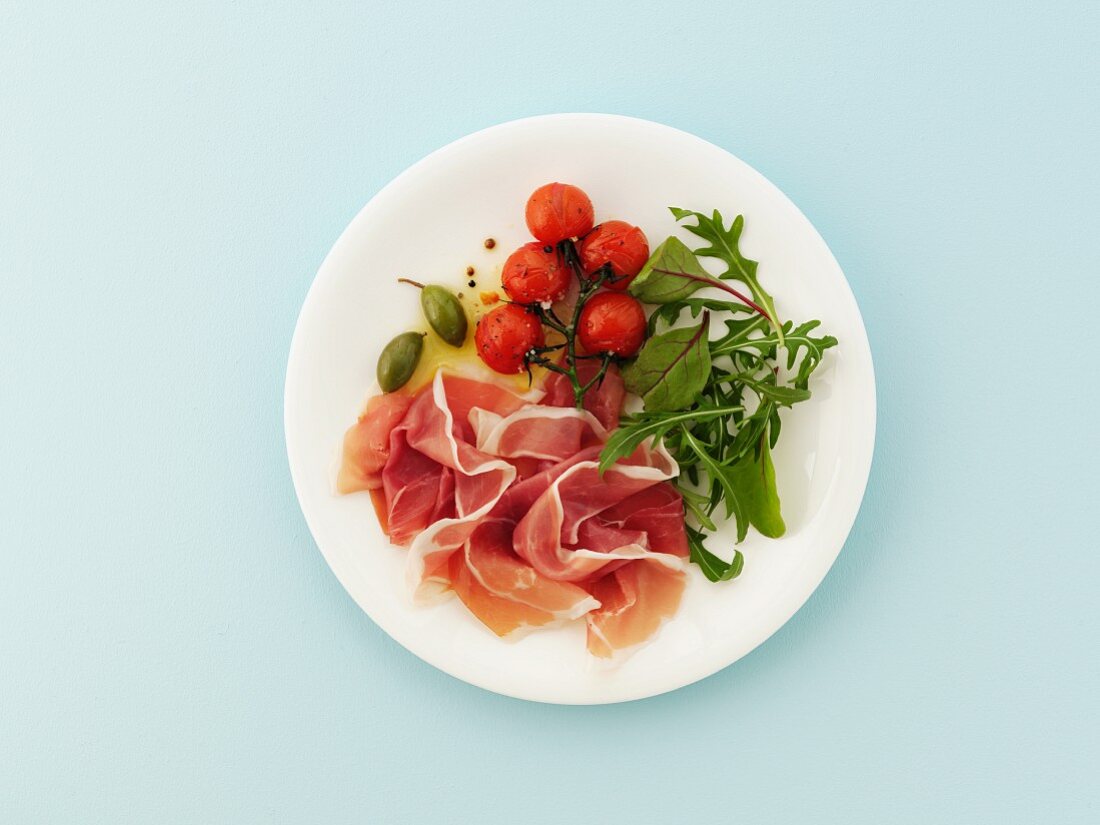 Proscuitto with roast tomatoes and salad