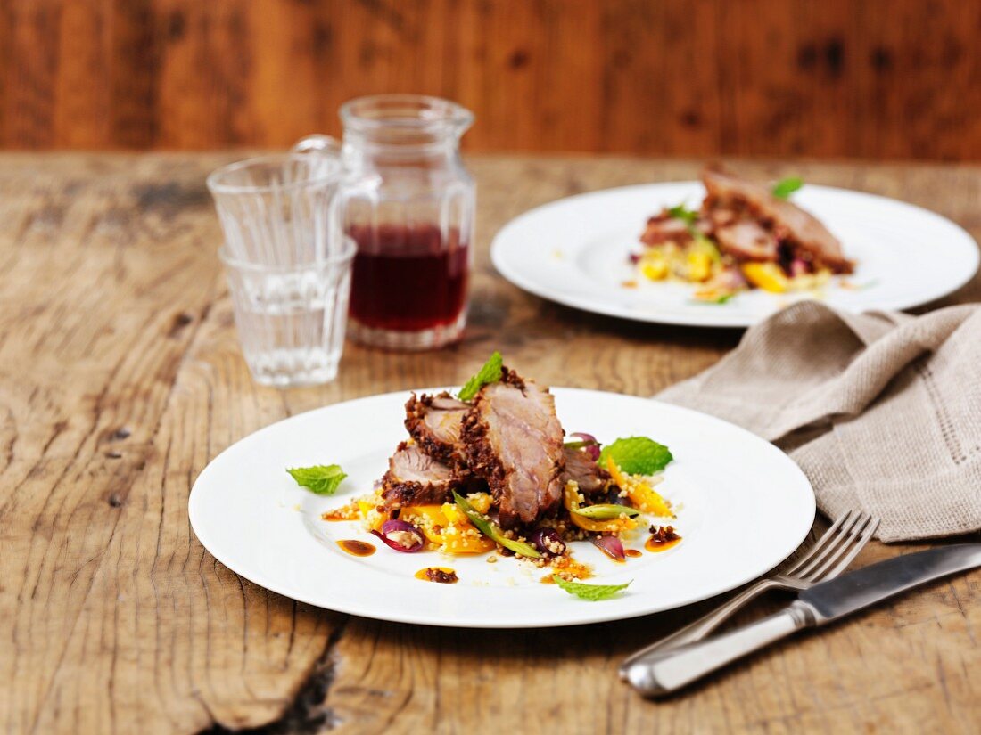 Roast shoulder of lamb with citrus fruits and a couscous and mint salad