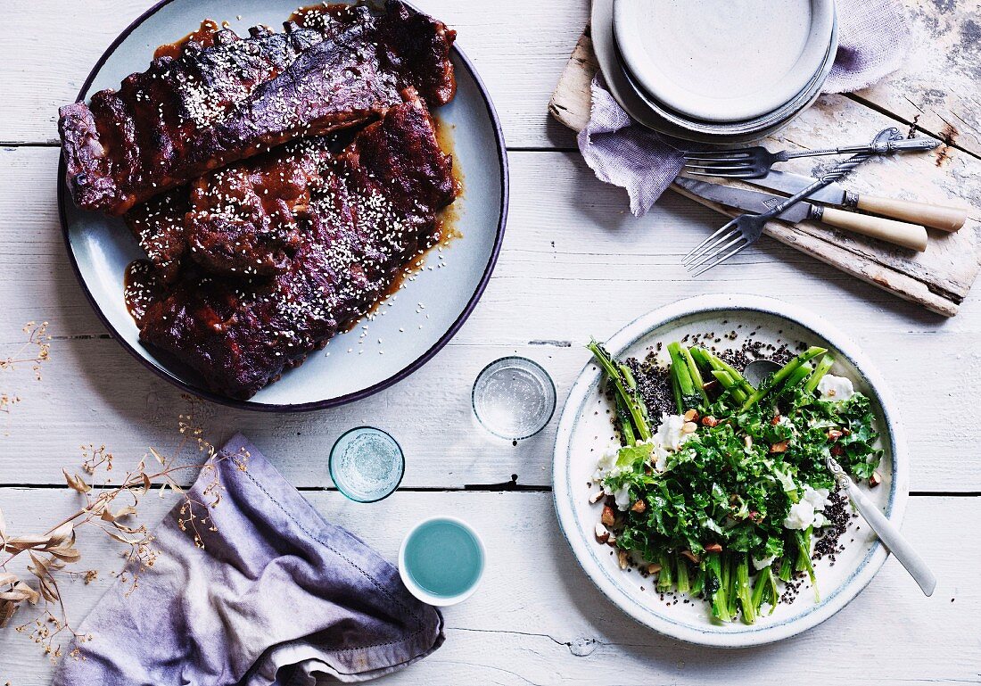 Glazed pork ribs served with kale salad with quinoa