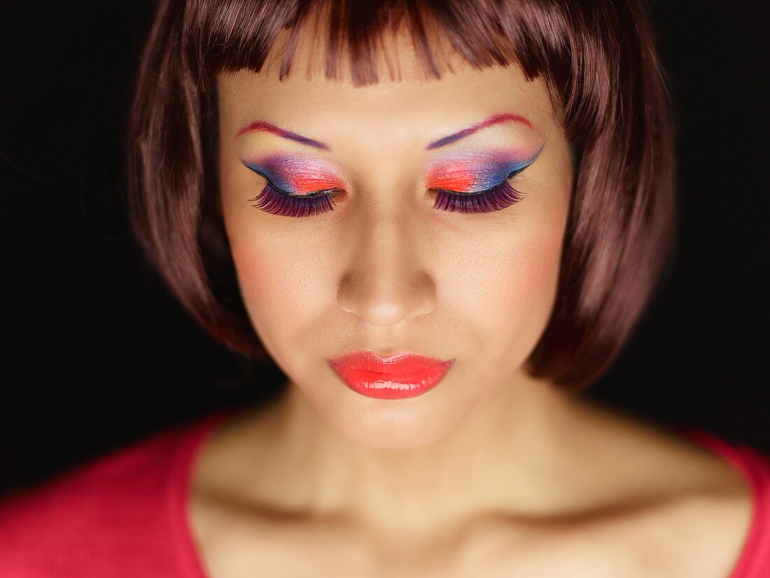 A young woman with colourful eyeshadow