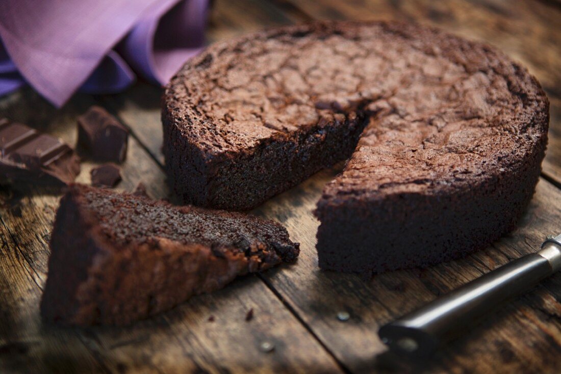 Gluten free chocolate cake on a wooden table