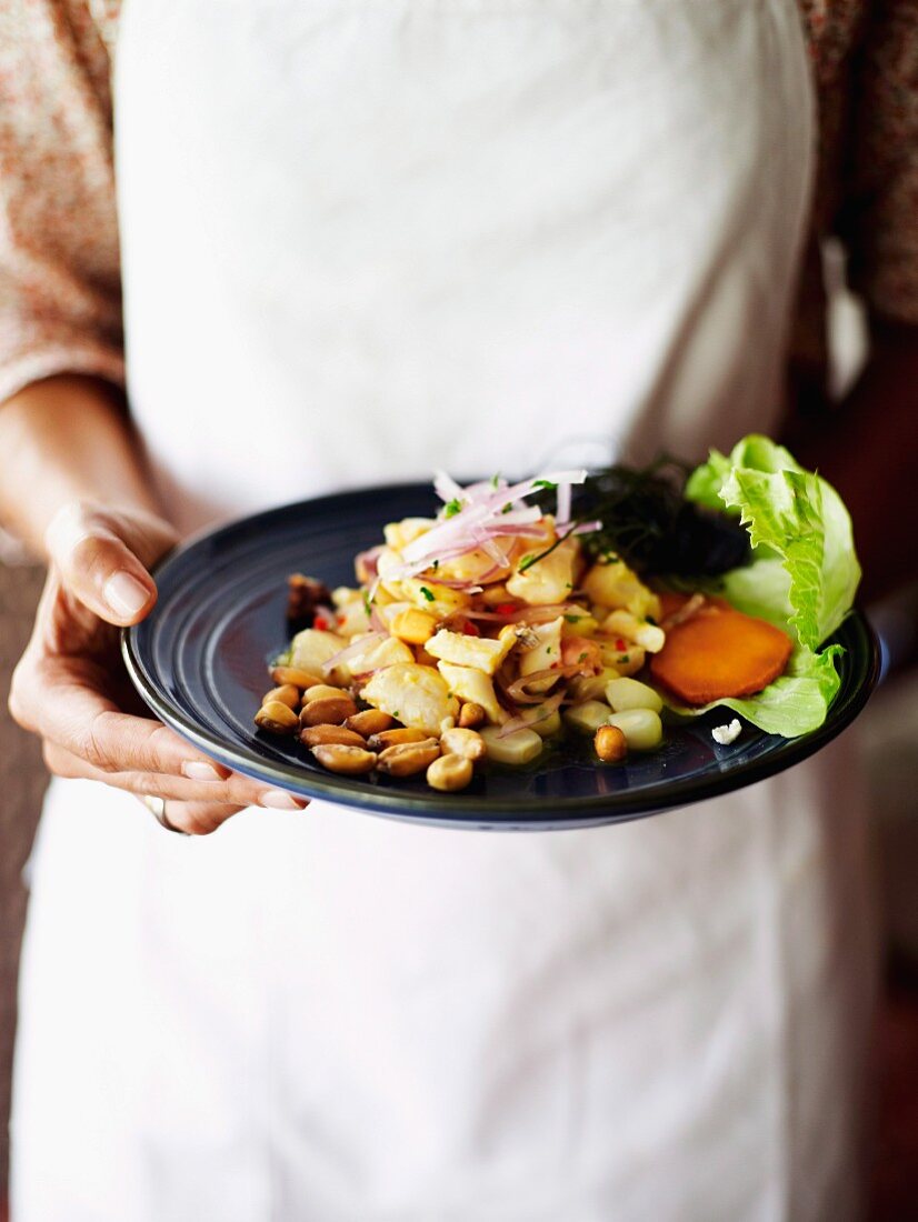 Ceviche served with corn and red onions, Peru