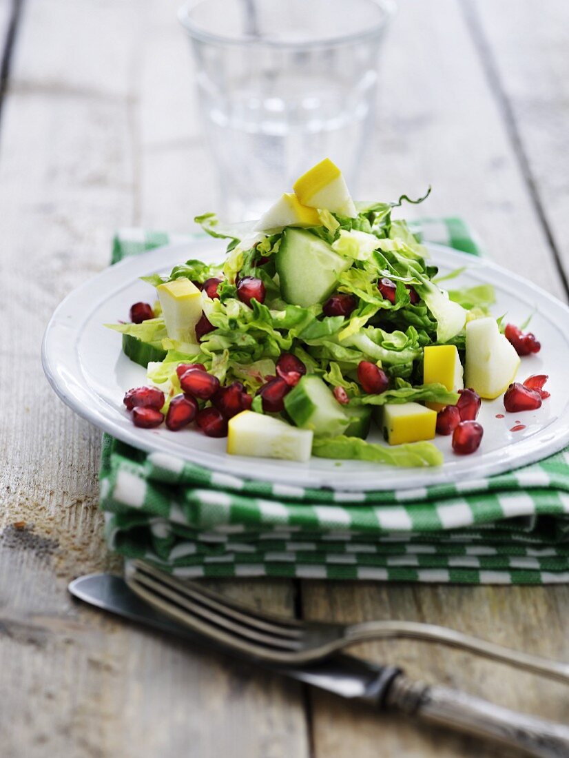 Mixed leaf salad with courgette, cucumber and pomegranate seeds