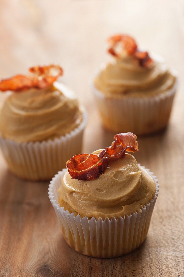 Sweet and salty cupcakes with maple syrup cream and bacon