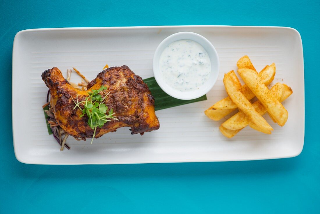 Chilli chicken with herb sauce and chips