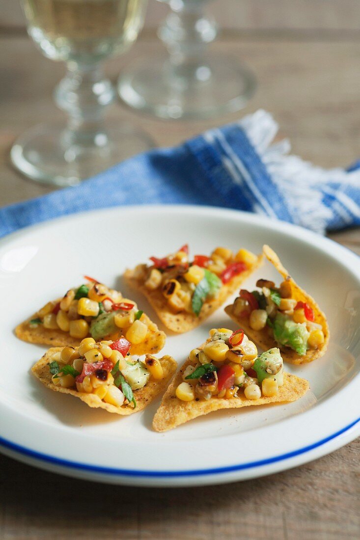 Tortilla chips with a sweetcorn and avocado salsa