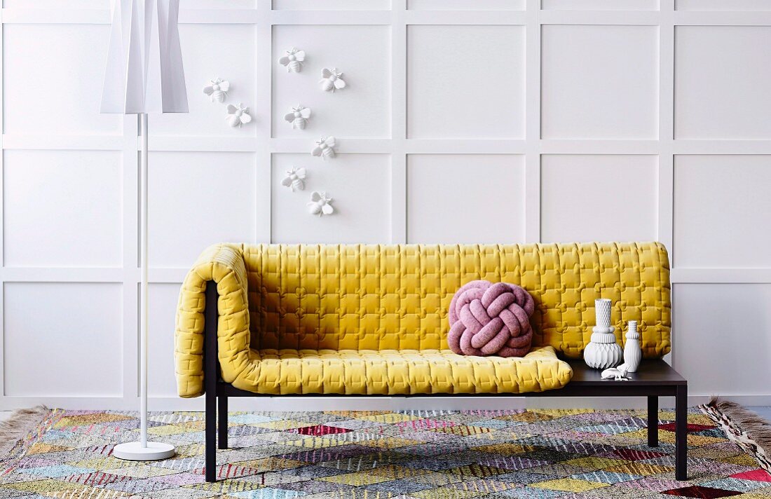 Yellow structured cushions and cushion made from interwoven cord on designer récamier