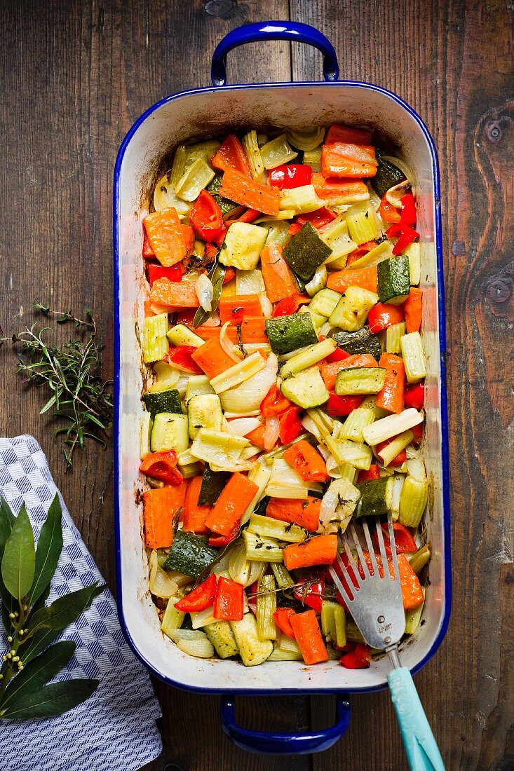 Oven-roasted vegetables in a roasting dish