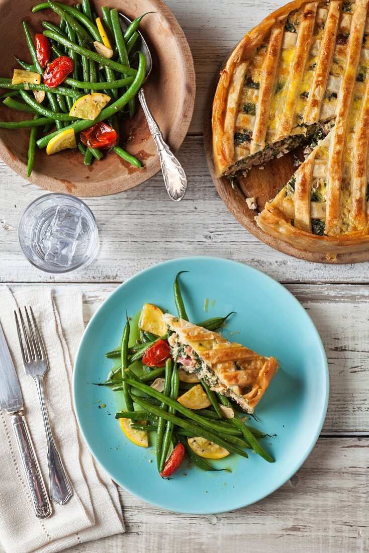 Pizza rustica with green beans, yellow courgettes and tomatoes