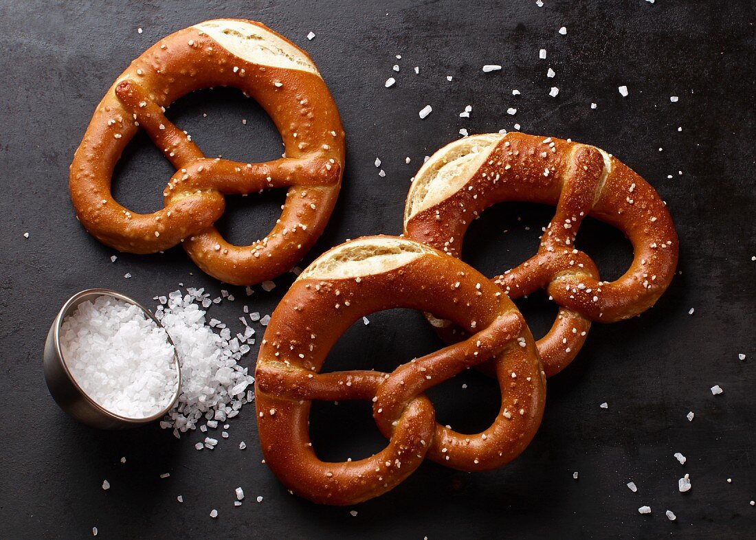 Three salted lye pretzels with coarse sea salt