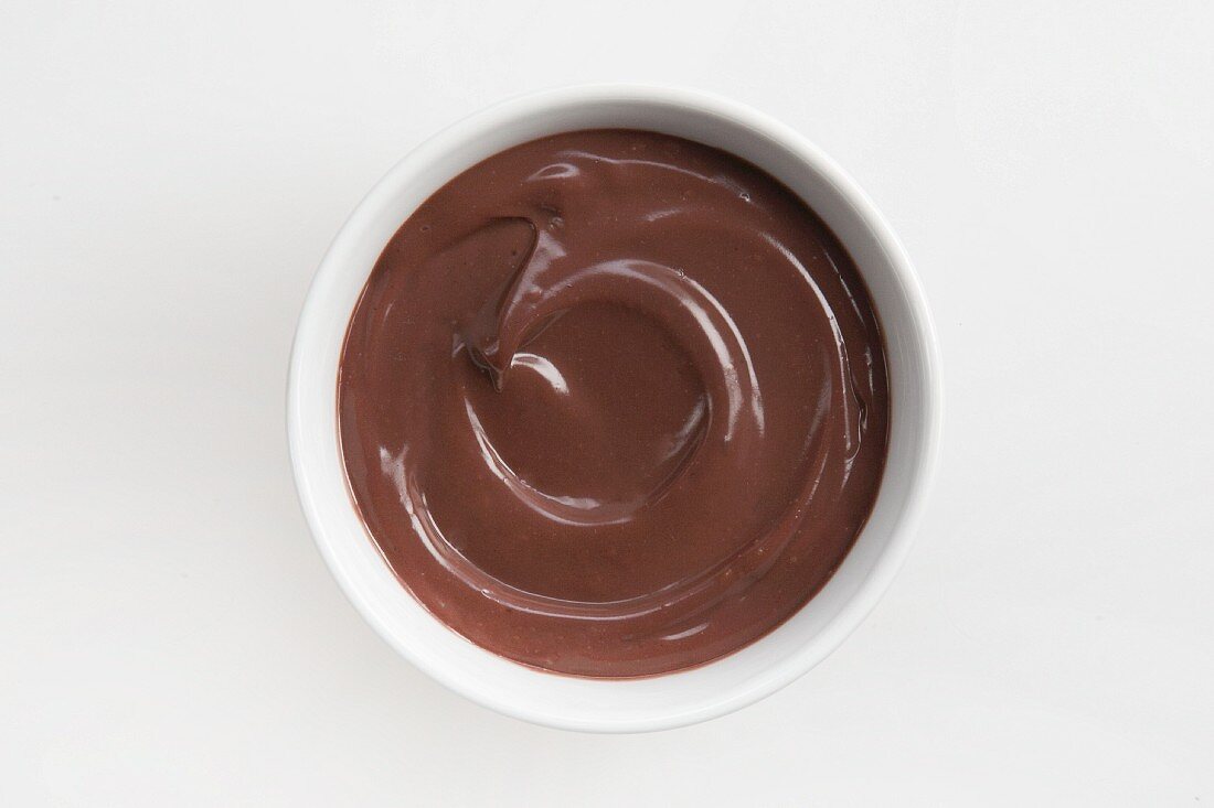 Chocolate pudding in white bowl