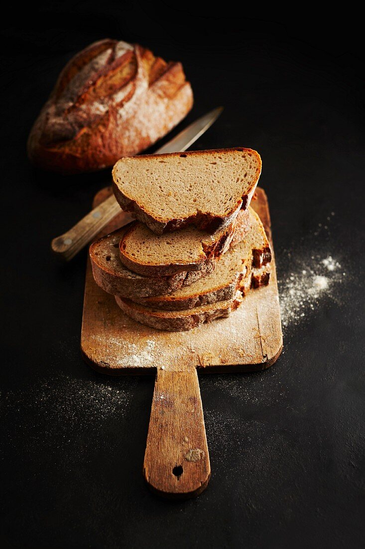 Sliced bread on a wooden board