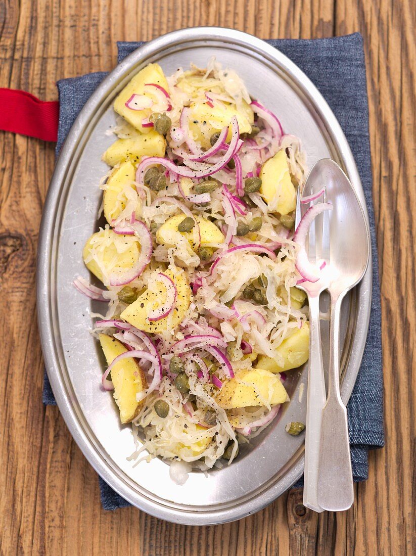 Potato and sauerkraut salad with red onions and capers