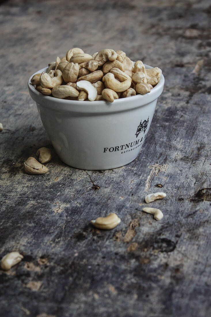 Cashew nuts in a bowl and next to it