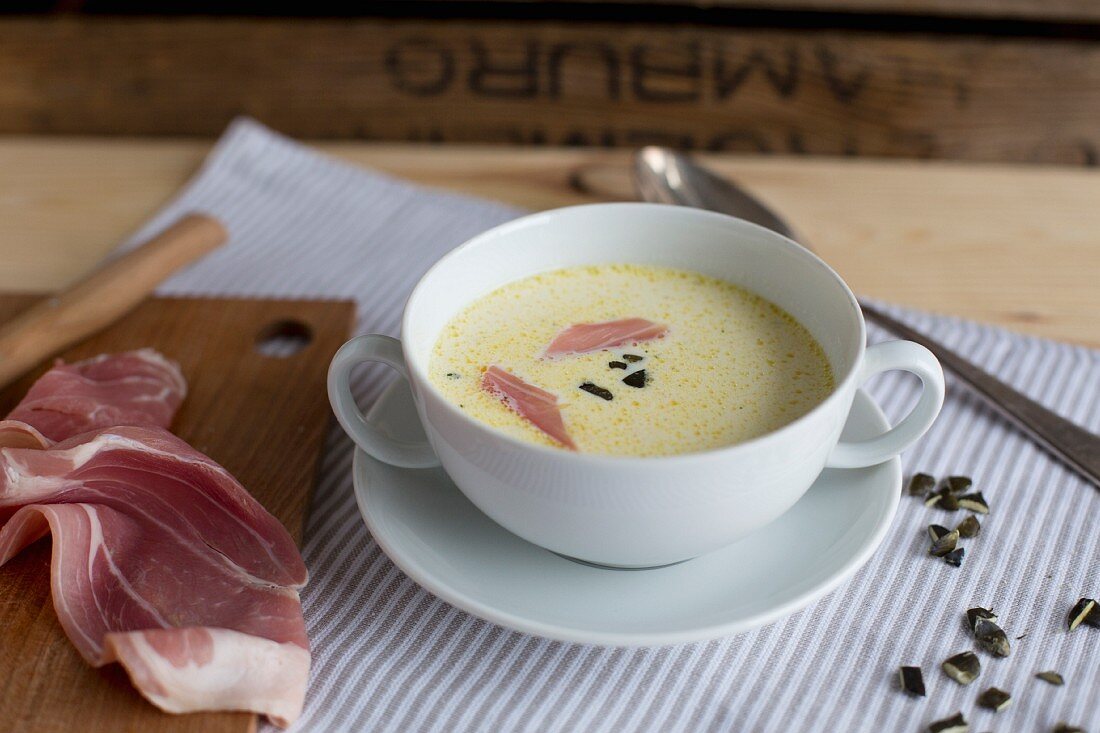 Celery soup with ham and pumpkin seeds