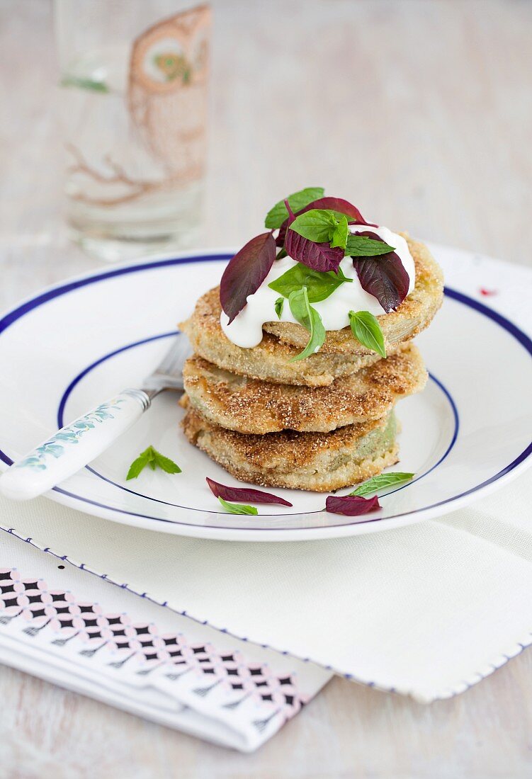 Fried green tomatoes with cornflour, yogurt and fresh herbs