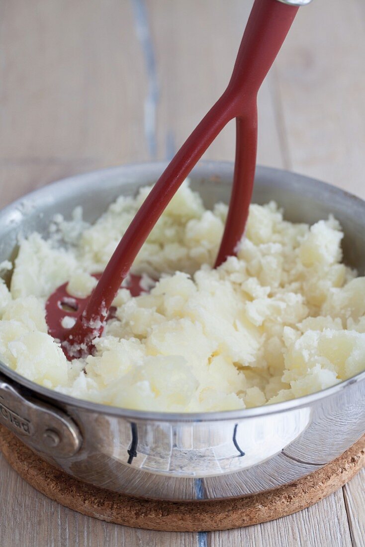 Potatoes being mashed