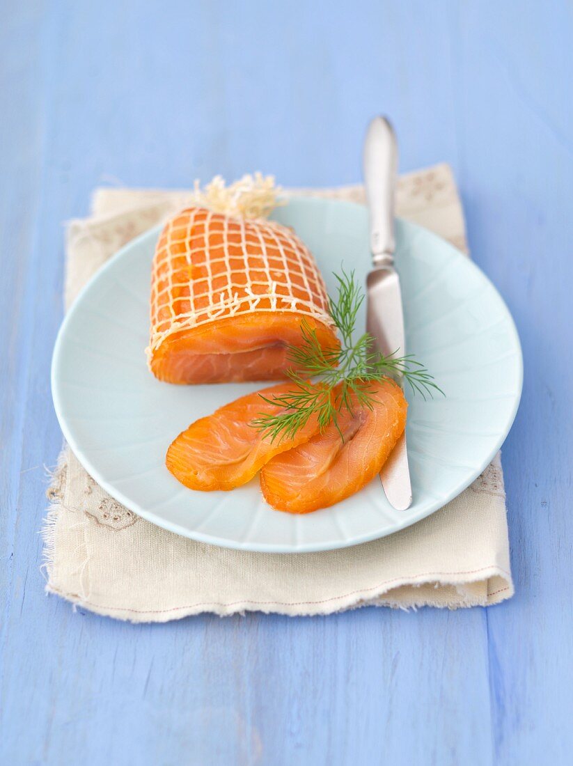 Smoked salmon in a net on a plate