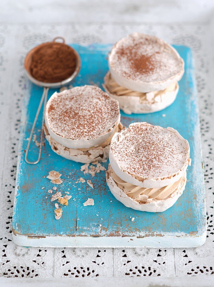 Coffee meringue with cream and cocoa powder