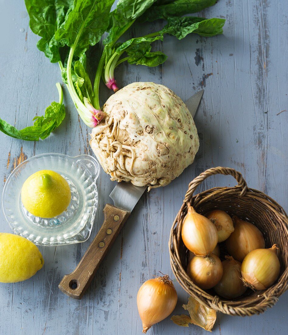 Detox food: a basket of onions, lemons, spinach and celery