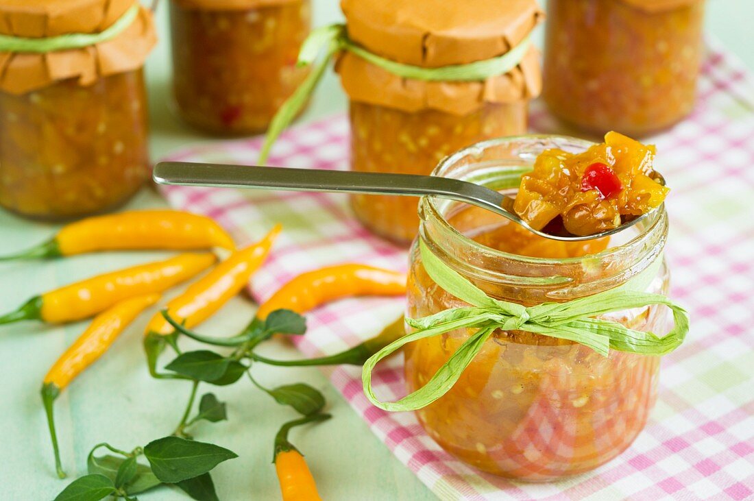 Jars of homemade chilli sambal and fresh chillis