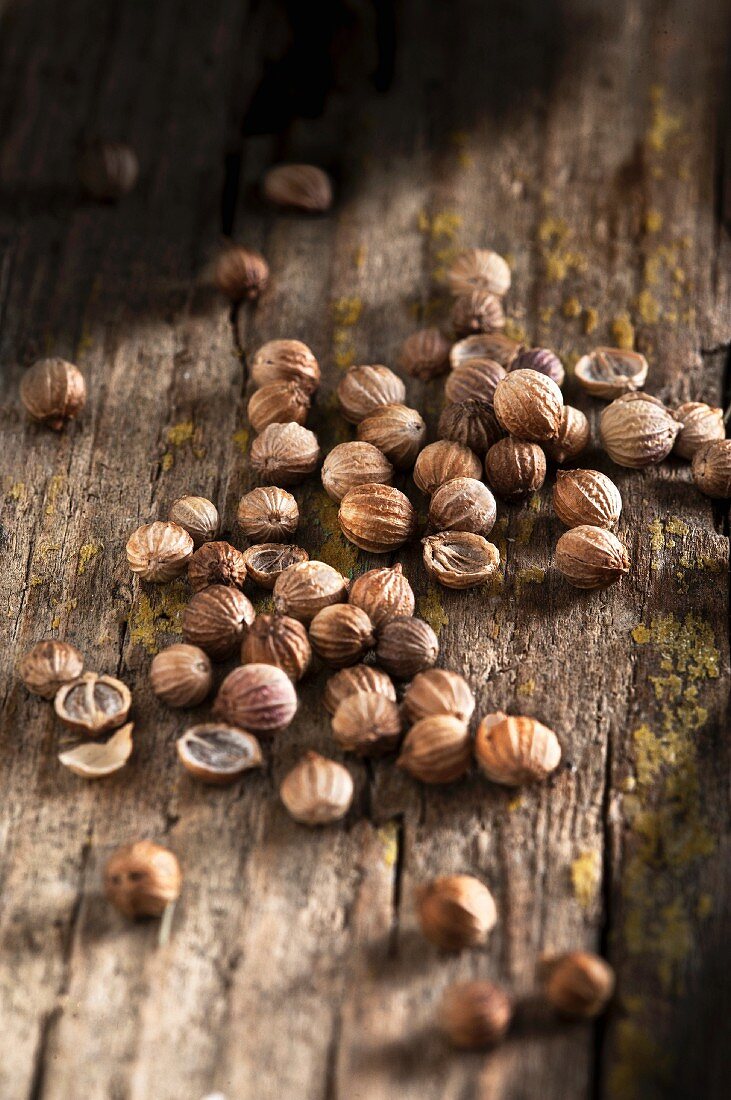 Coriander seeds on a wooden surface