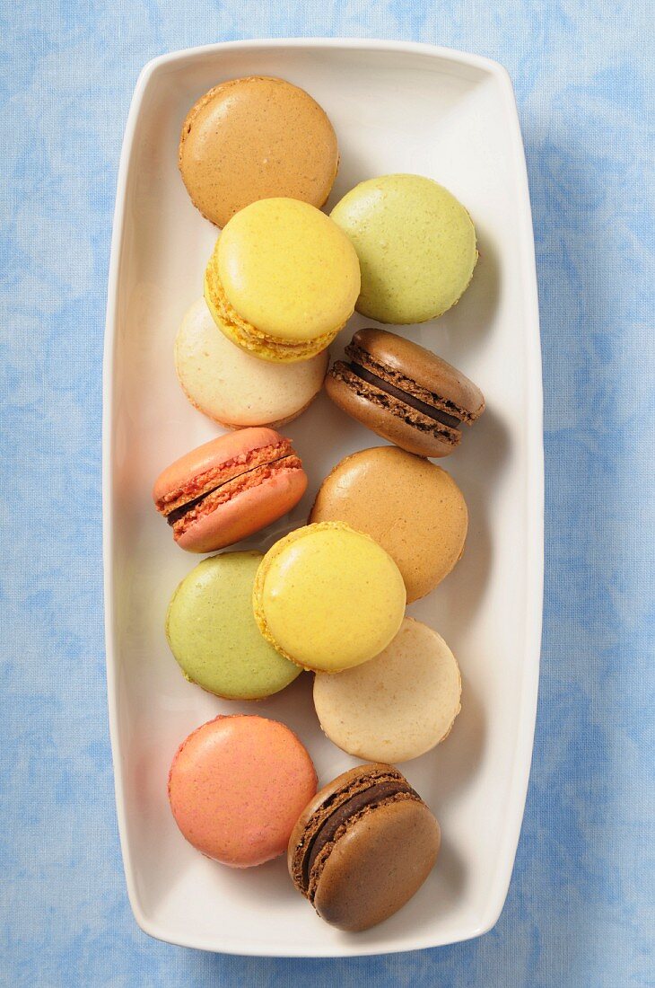 A dish of various pastel-coloured macaroons