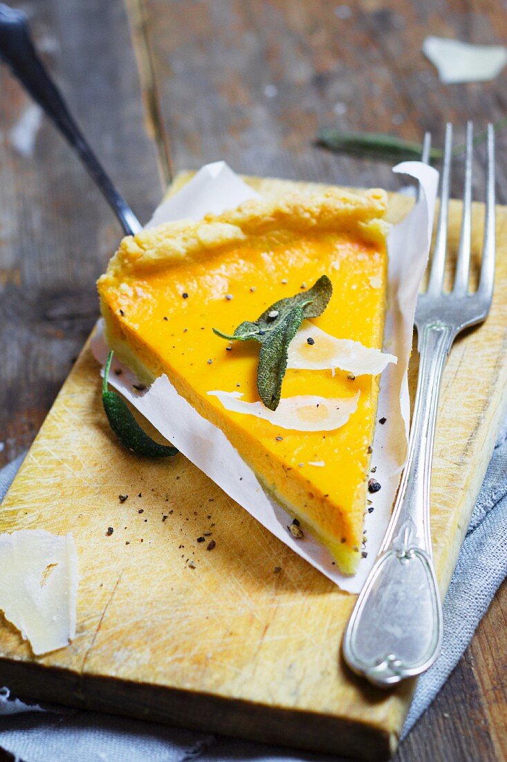 A slice of pumpkin quiche with sage and Parmesan cheese