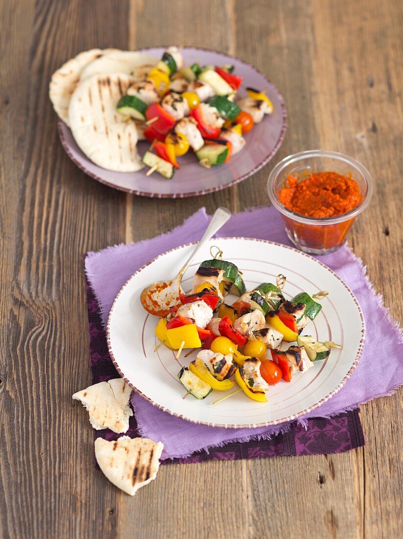 Turkey breast and vegetable skewers with ajvar and unleavened bread