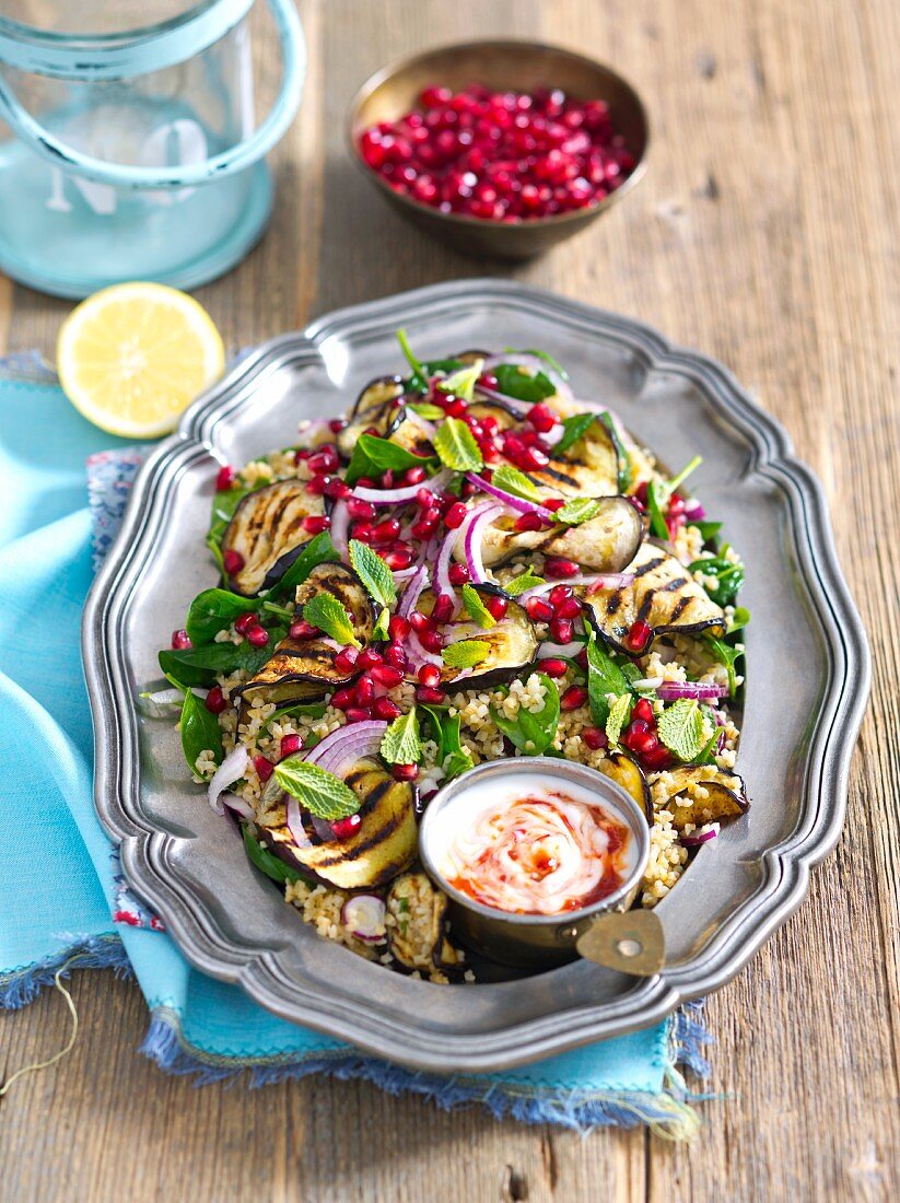 Bulgur salad with grilled aubergines, onions, mint and pomegranate seeds