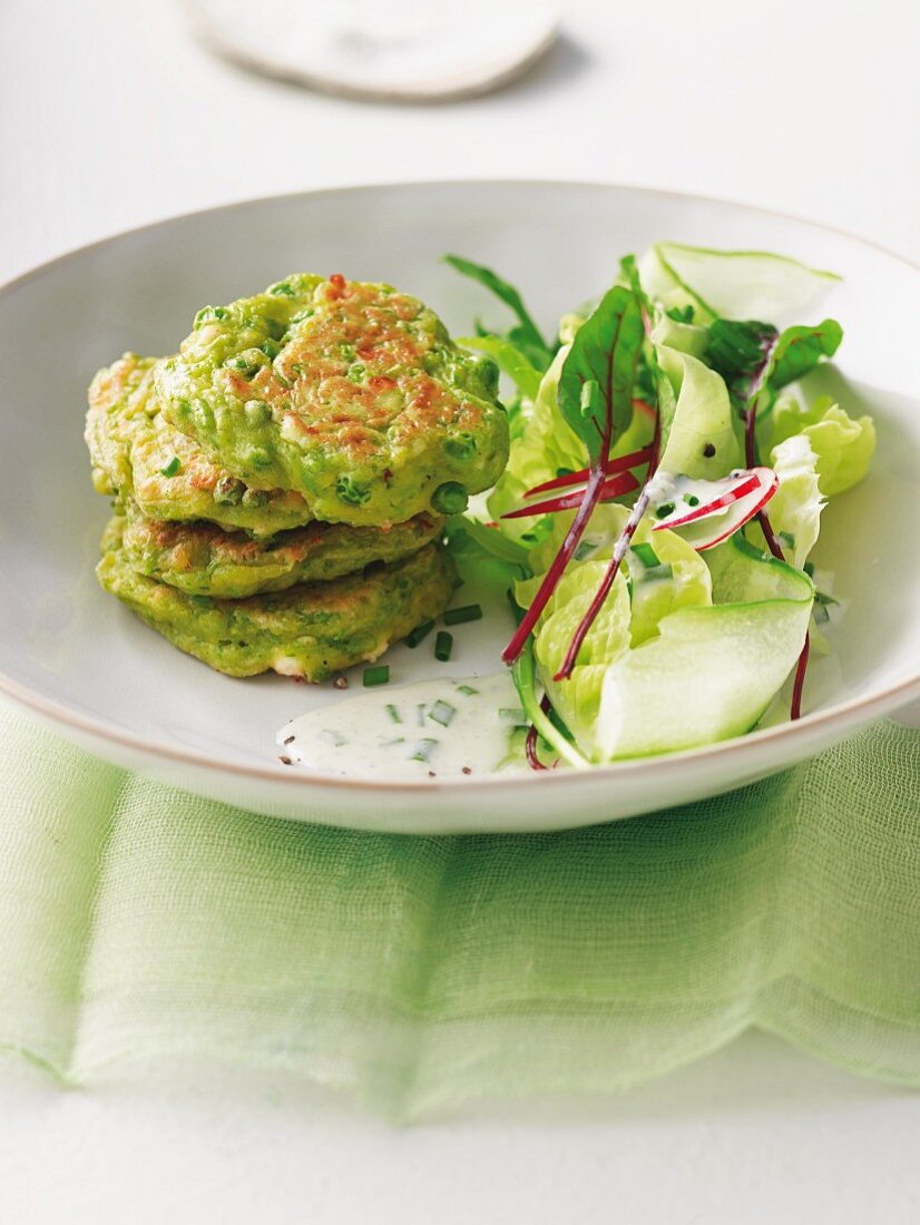 Pea and mint cakes with a mixed leaf salad