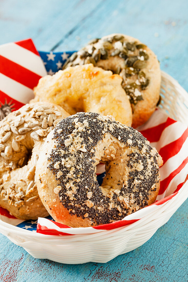 Bagels in a bread basket with a USA cloth