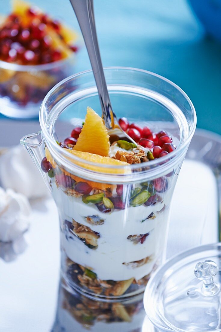 Granola with pomegranate, oranges and pistachios
