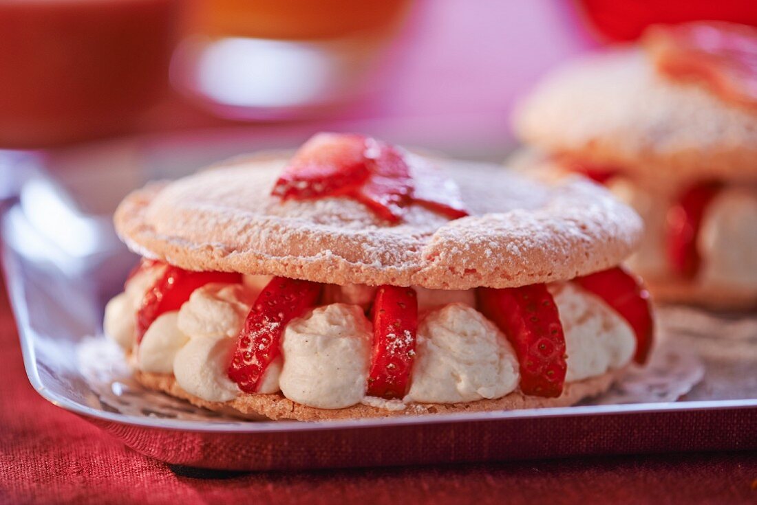 A meringue cake filled with cream and strawberries
