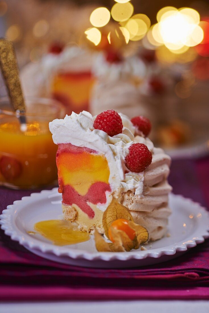 A slice of meringue tart with a fruit ice cream filling