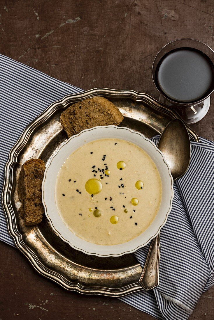 Cheese soup with olive oil and black caraway