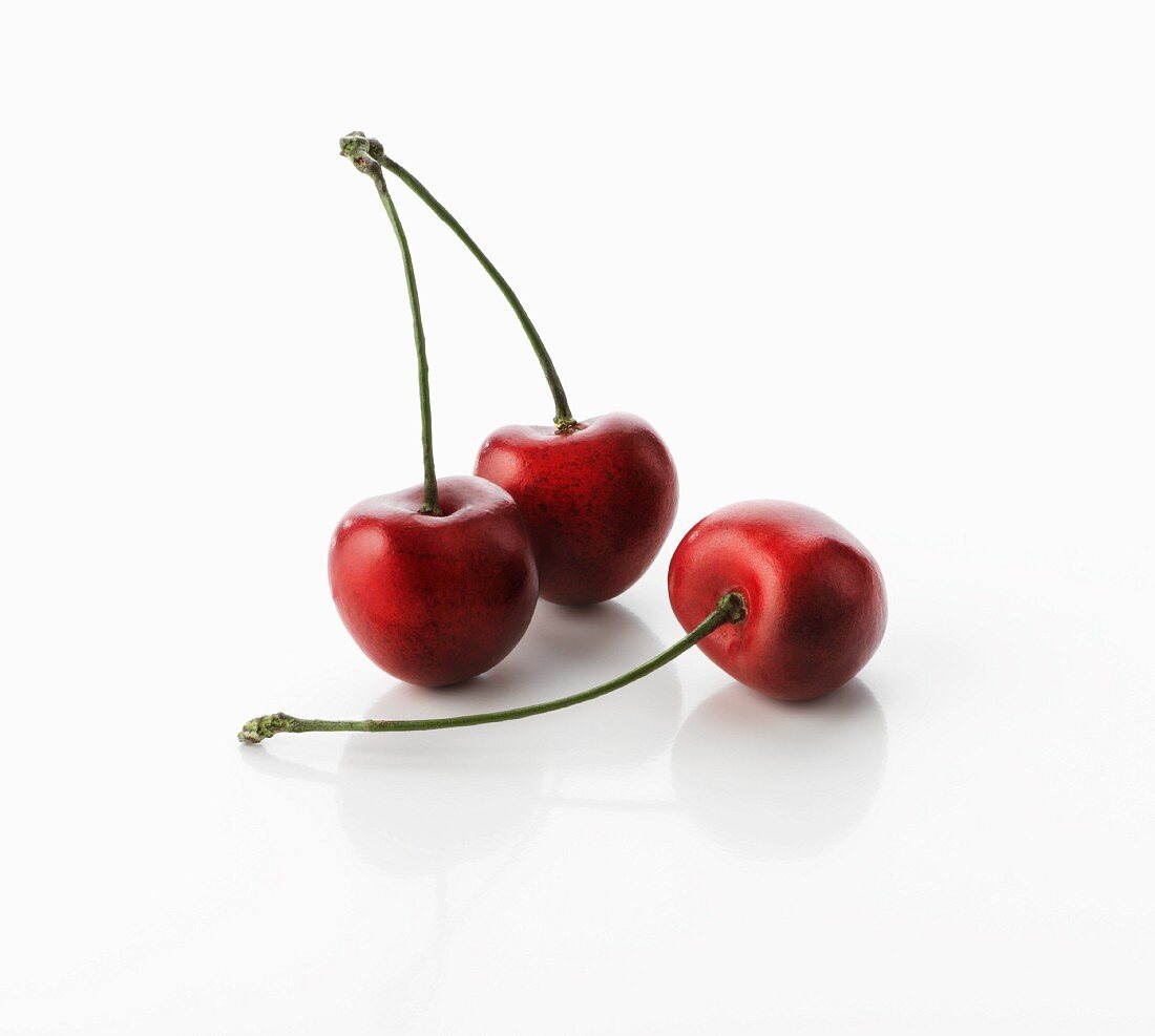 Three cherries with stalks