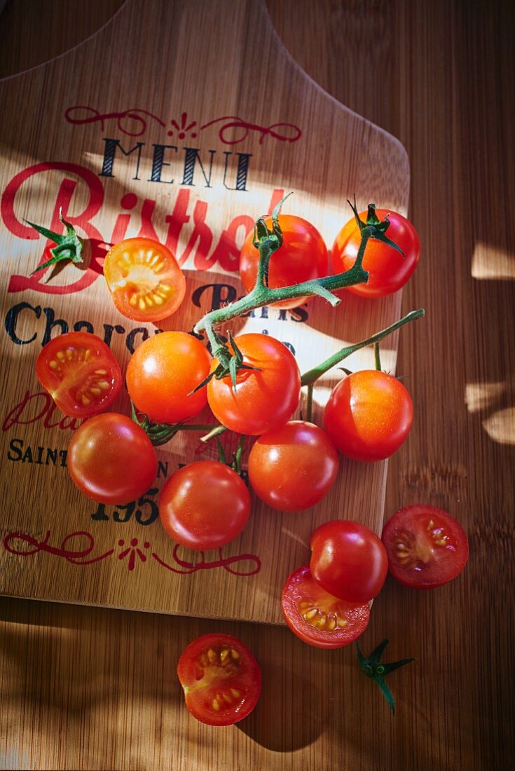 Cherry tomatoes on chopping board