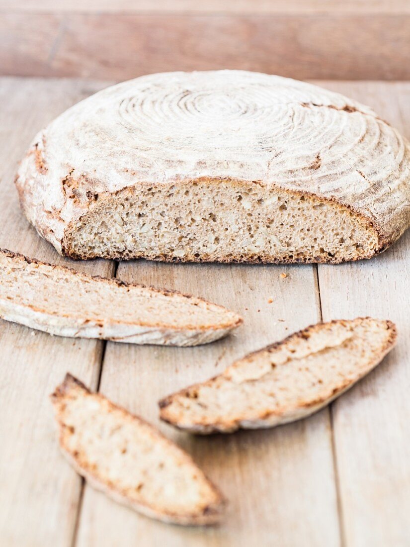 A round loaf of homemade sour dough rye-wheat bread